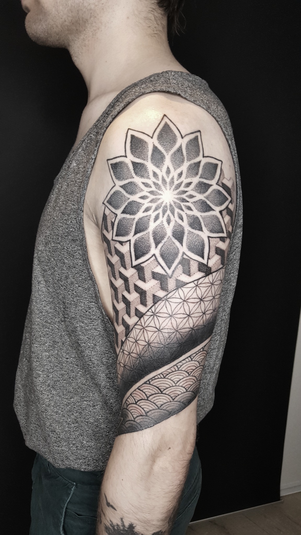 Geometric dotwork sleeve tattoo