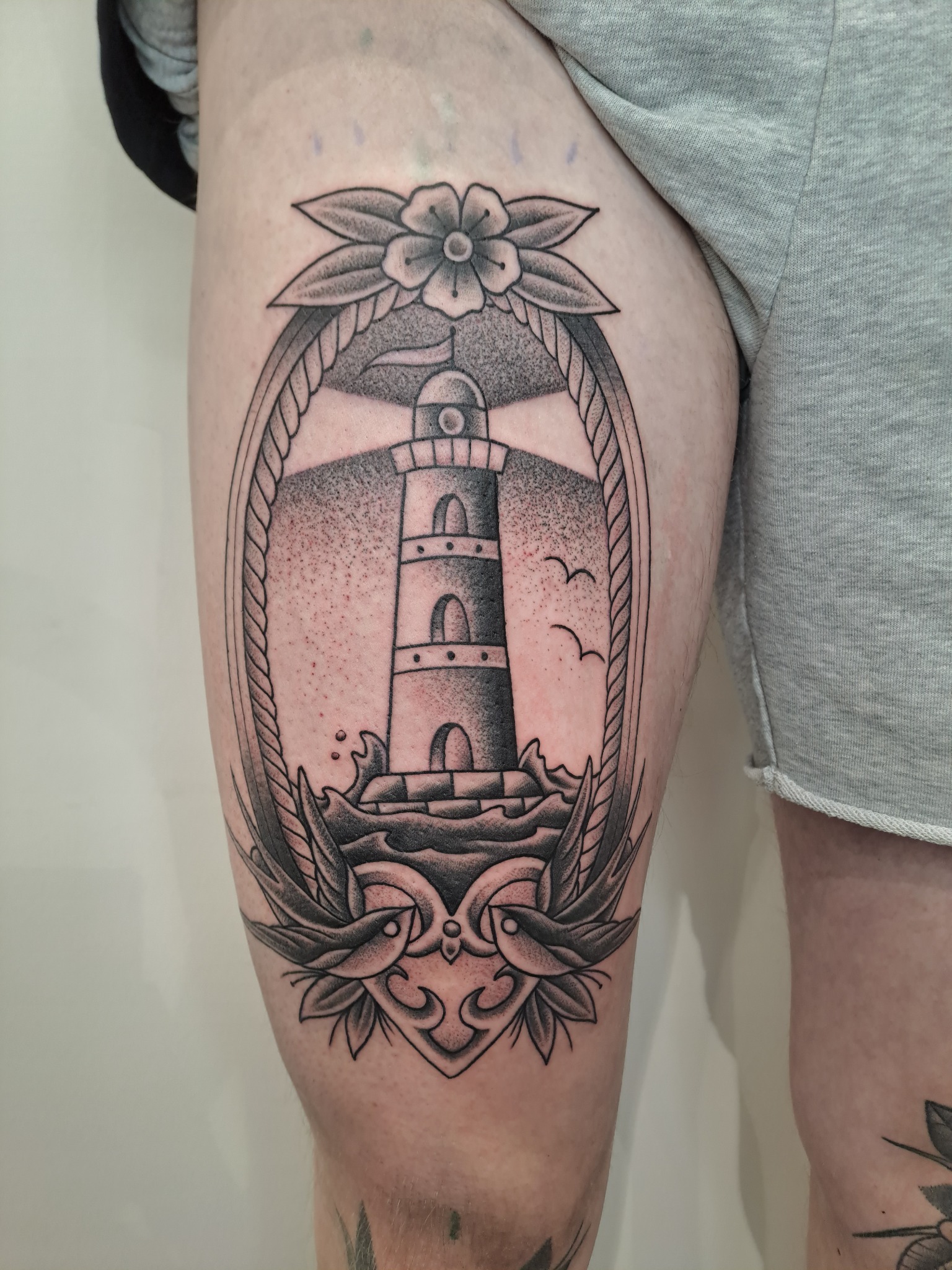 Blackwork lighthouse tattoo