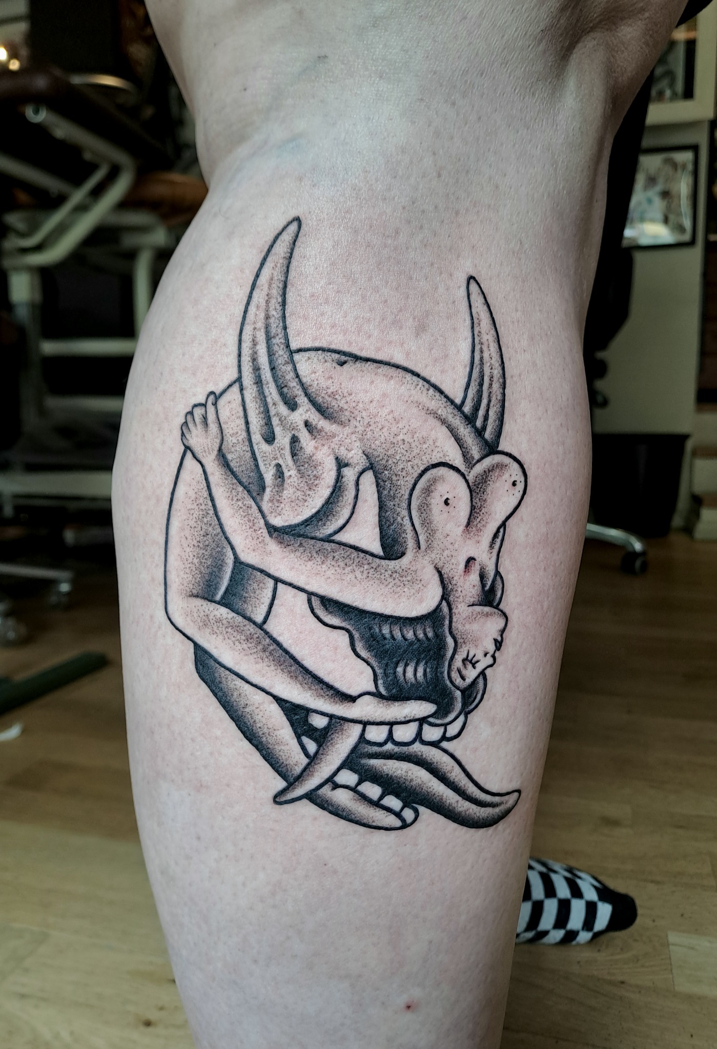 Blackwork oni mask tattoo