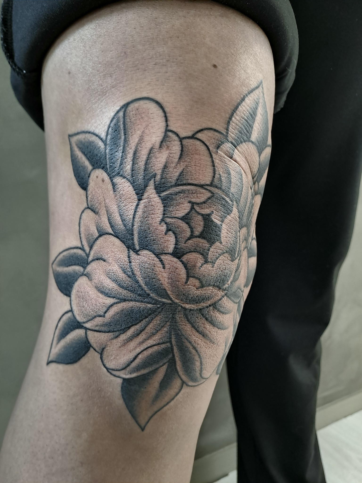 Blackwork peony tattoo