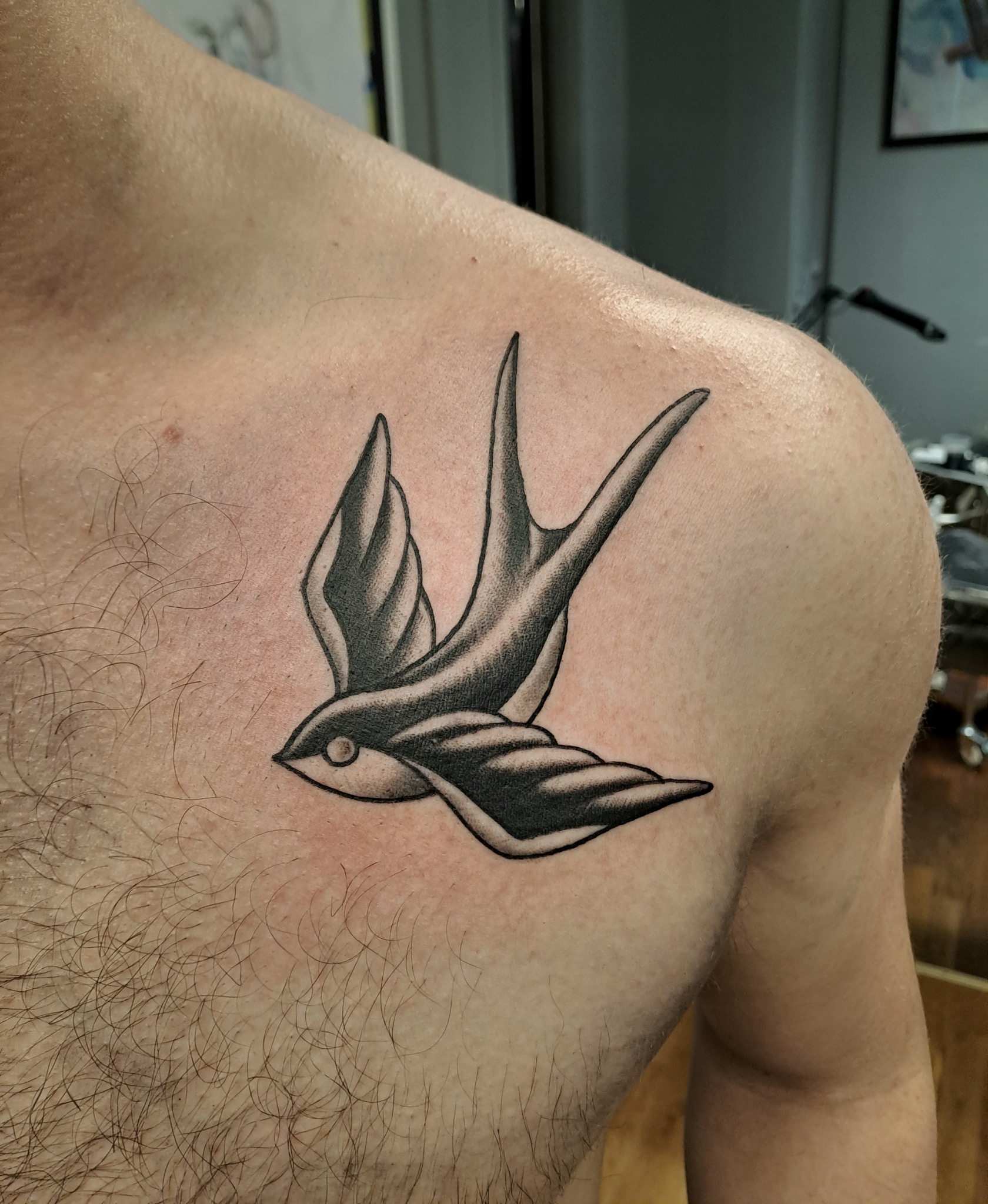 Traditional blackwork swallow tattoo